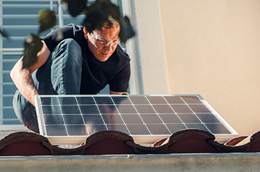 Man installing solar panel